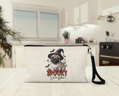 Spooky Season Pug Makeup Bag on a kitchen counter