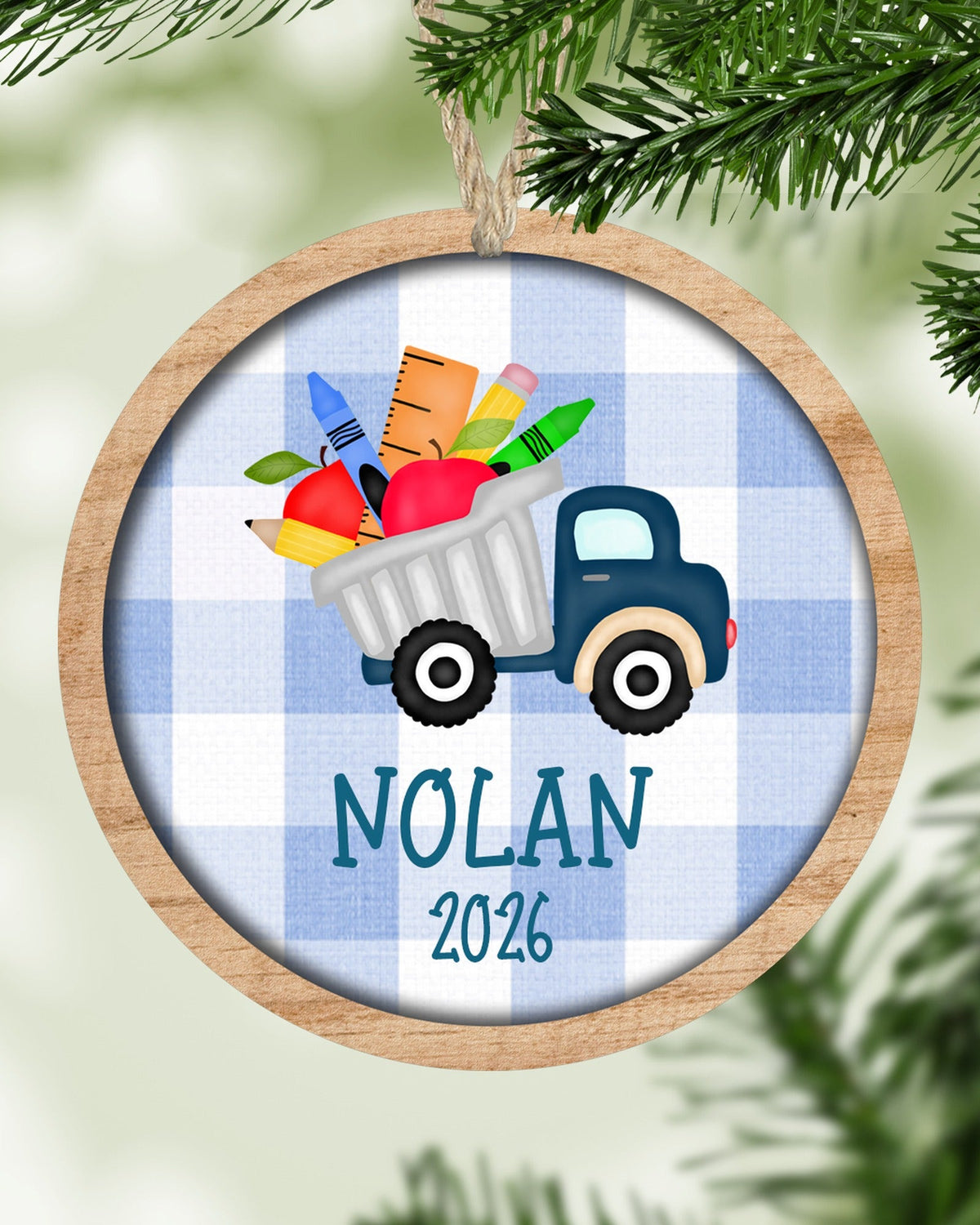 Personalized school supplies truck Christmas ornament hanging on a tree