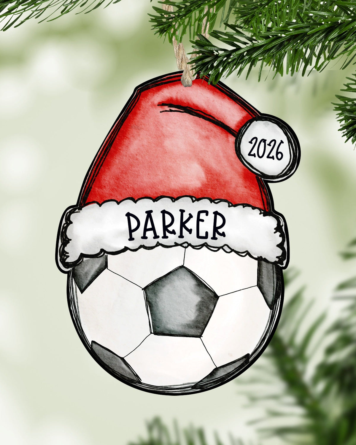 Personalized soccer Christmas ornament hanging on a Christmas tree - The Painted Pug