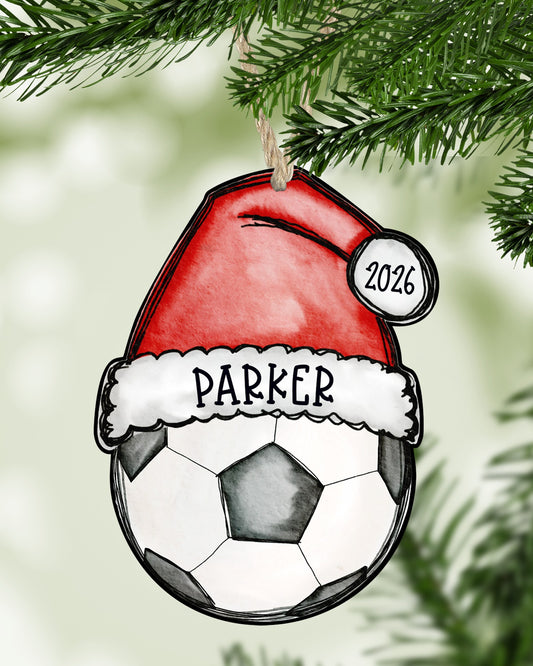 Personalized soccer Christmas ornament hanging on a Christmas tree - The Painted Pug