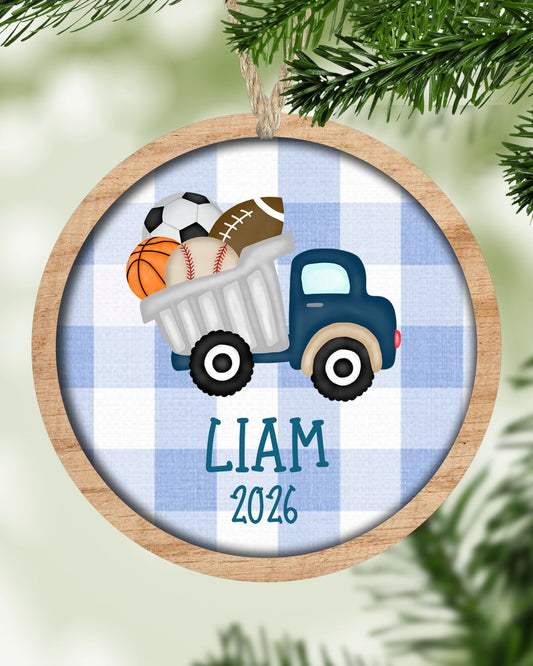 Personalized sports truck Christmas ornament hanging on a Christmas tree - The Painted Pug