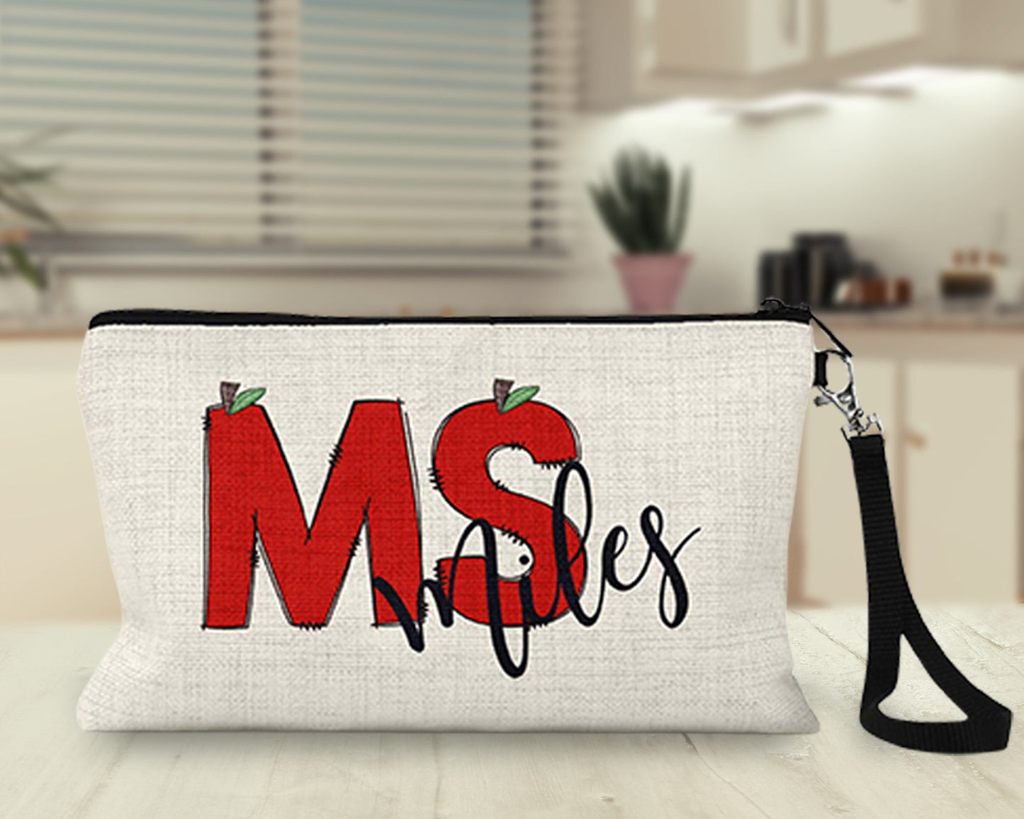 Personalized teacher apple Makeup Bag on a kitchen counter