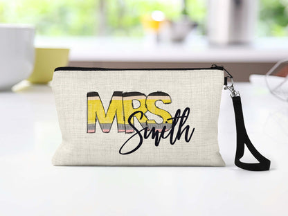 Personalized teacher pencil letters Makeup Bag on a counter