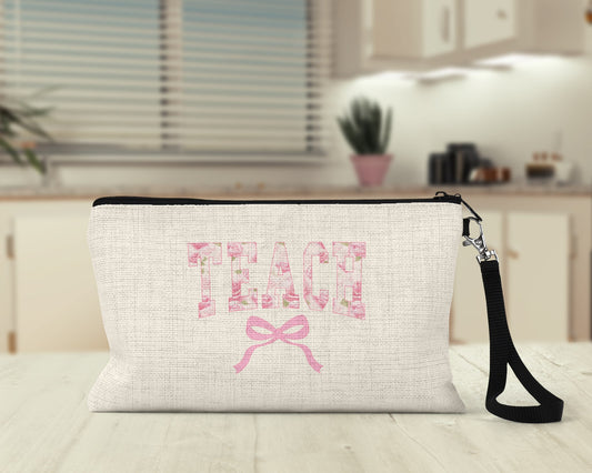 Teach pink bow Makeup Bag on a kitchen counter
