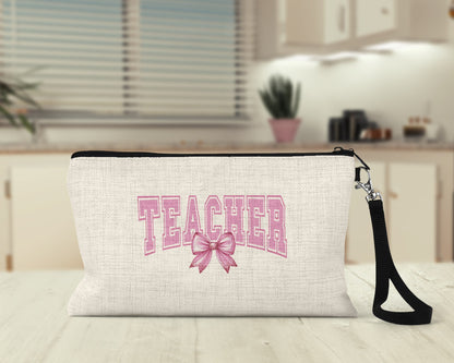 Teacher pink bow varsity Makeup Bag on a kitchen counter