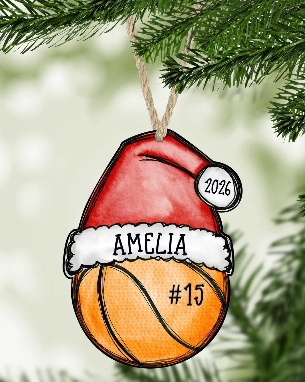 Basketball Christmas ornament hanging on a Christmas tree - The Painted Pug