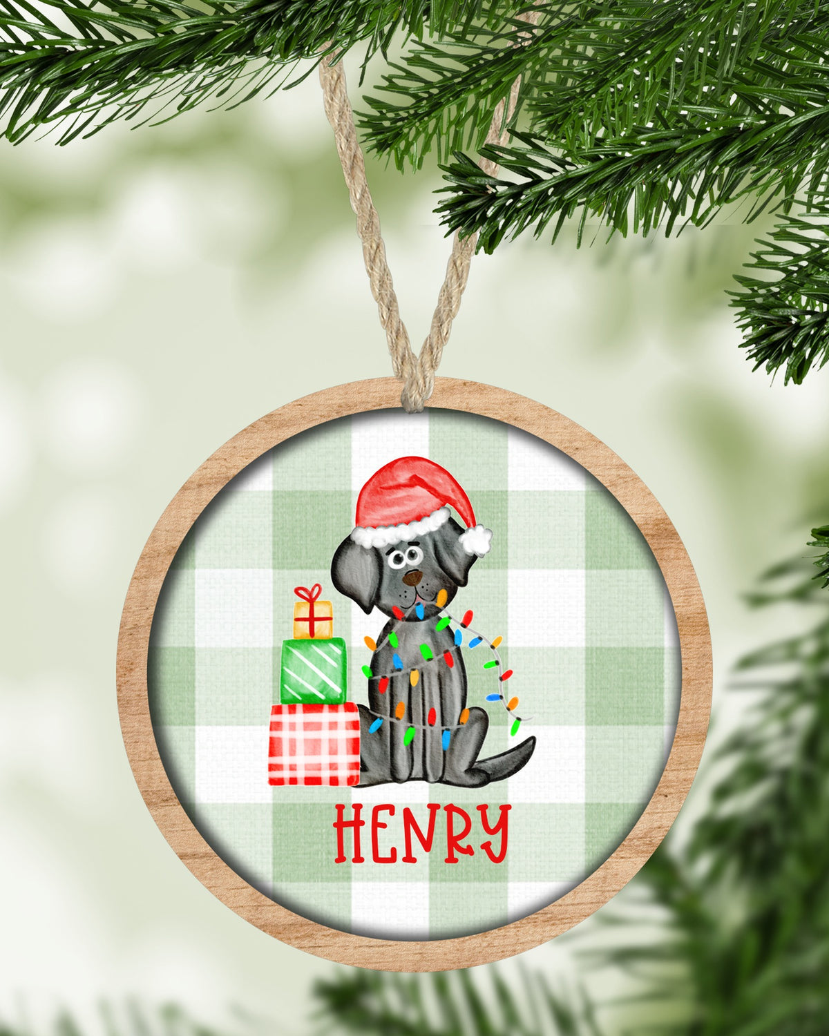 Black Lab dog Christmas ornament hanging on a Christmas tree - The Painted Pug
