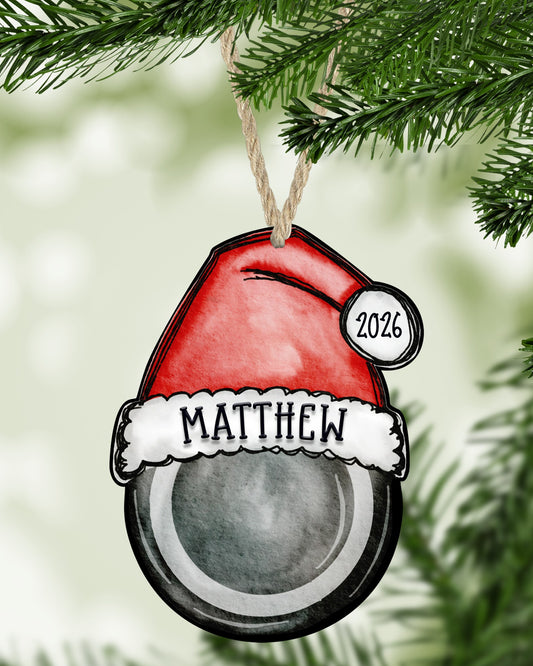 Hockey Christmas ornament hanging on a Christmas tree - The Painted Pug