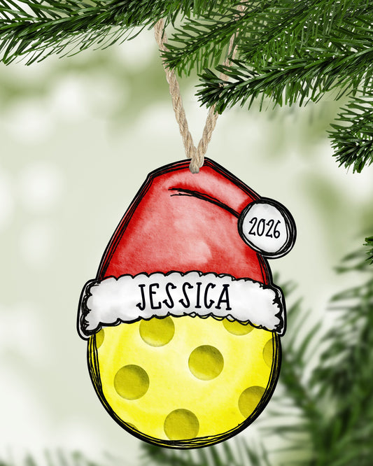 Pickleball Christmas ornament hanging on a Christmas tree - The Painted Pug