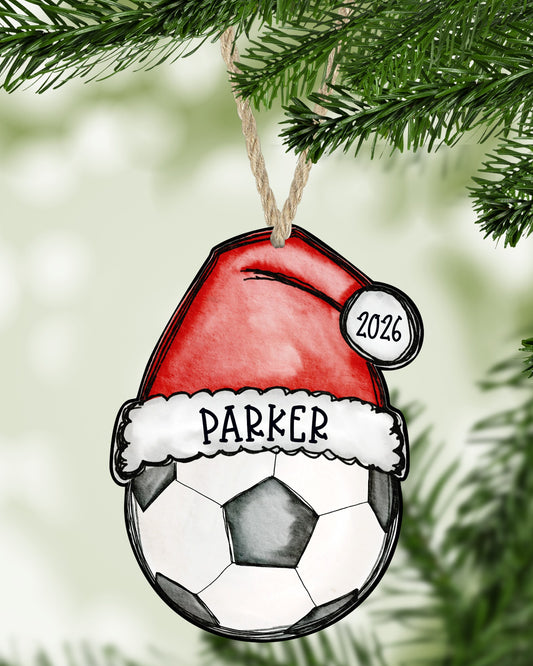 Soccer Christmas ornament hanging on a Christmas tree - The Painted Pug