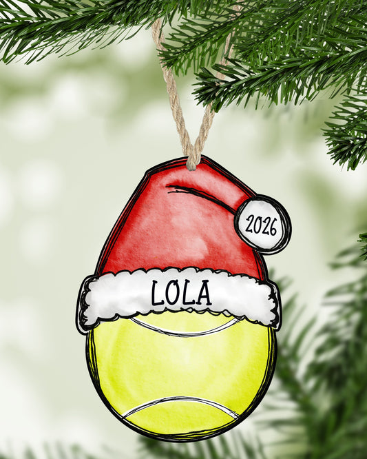Tennis Christmas ornament hanging on a Christmas tree - The Painted Pug
