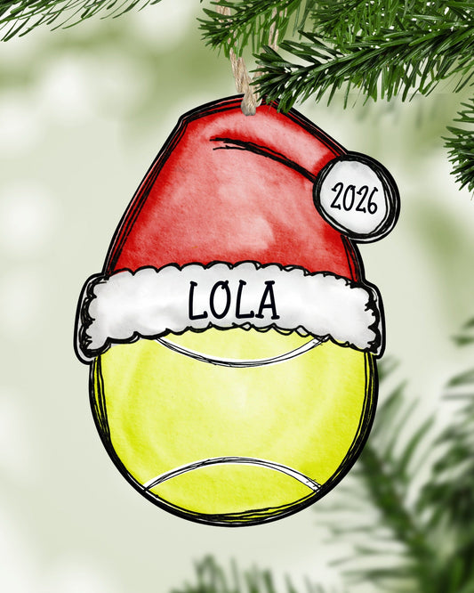 Personalized tennis Christmas ornament hanging on a Christmas tree - The Painted Pug