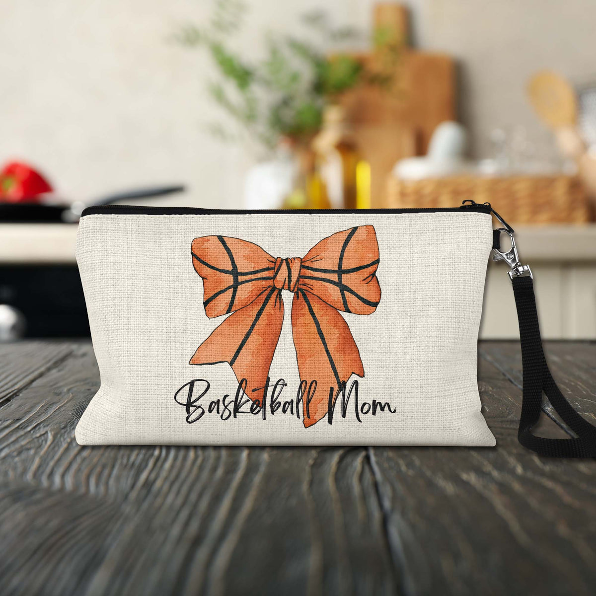 Basketball Mom Bow Makeup Bag on a kitchen counter