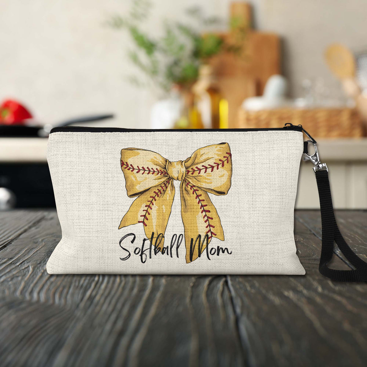Softball Mom Bow Makeup Bag on a kitchen counter