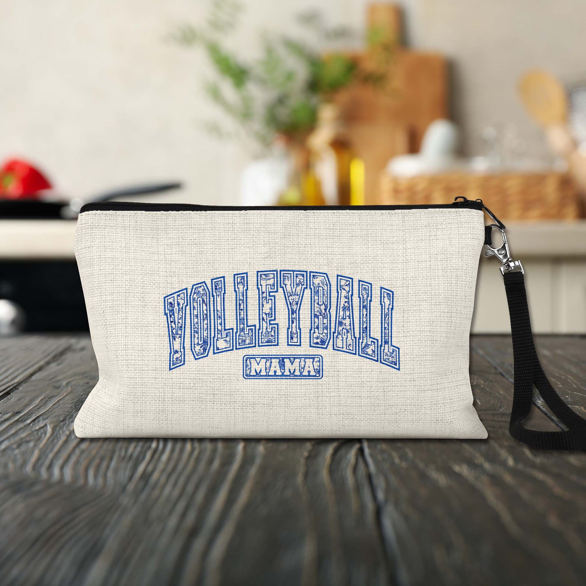 Volleyball Mama Blue Toile Makeup Bag on a kitchen counter