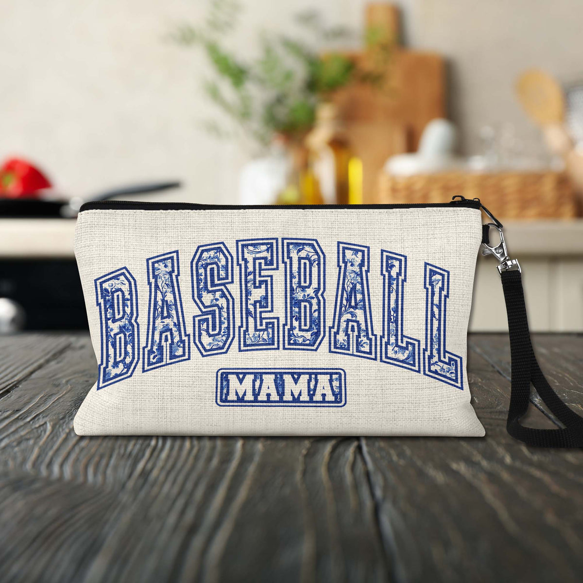 Baseball Mama Blue Toile Makeup Bag on a kitchen counter