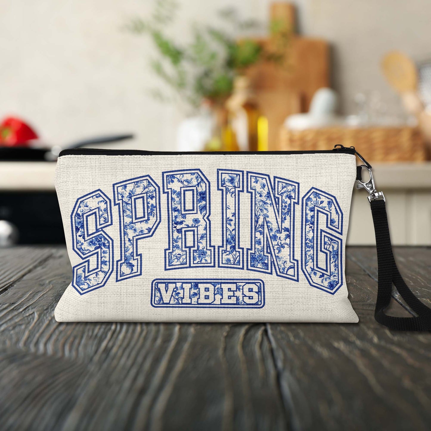 Spring Vibes Blue Toile Makeup Bag on a kitchen counter