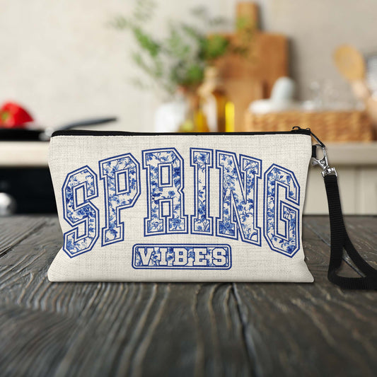 Spring Vibes Blue Toile Makeup Bag on a kitchen counter