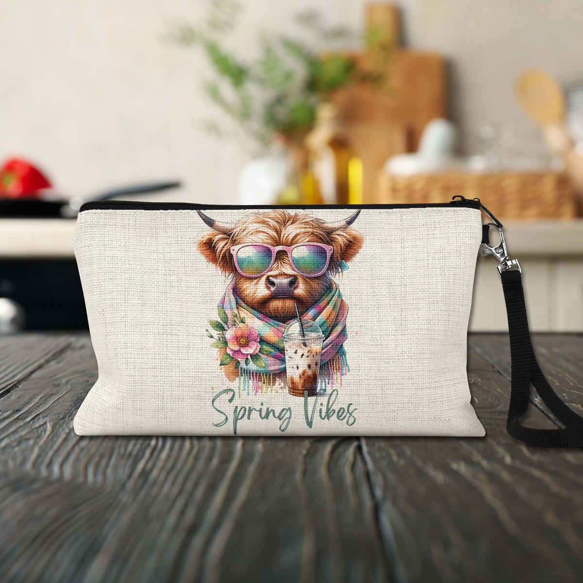 Spring Vibes Highland Cow Makeup Bag on a kitchen counter