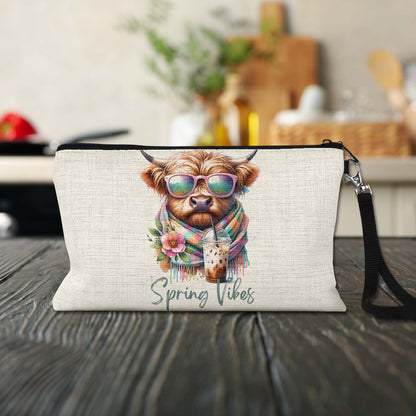 Spring Vibes Highland Cow Makeup Bag on a kitchen counter