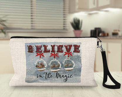 Believe in the Magic Snow Globe Makeup Bag on a kitchen counter
