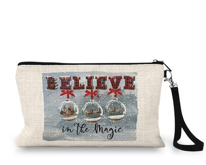 Believe in the Magic Snow Globe Makeup Bag front view on a white background