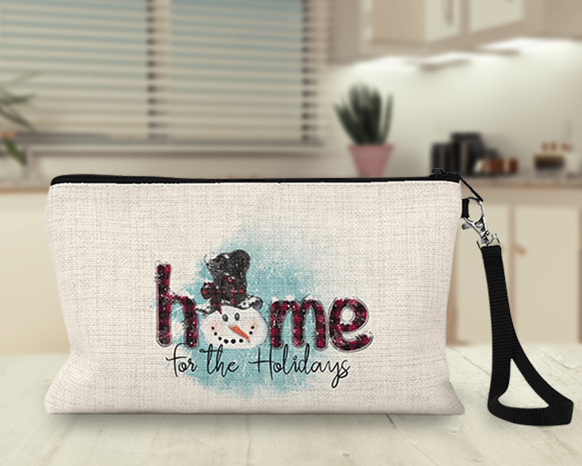 Home for the Holidays snowman Makeup Bag on a kitchen counter