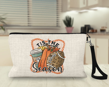 Tis the Season pumpkin latte and football Makeup Bag on a kitchen counter